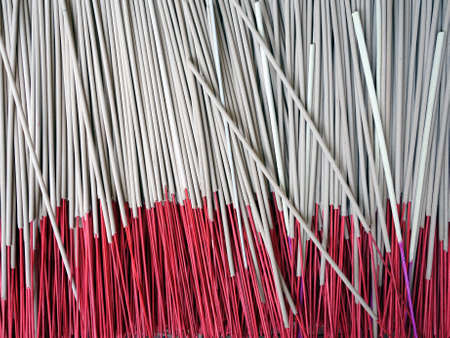 heap of incense sticks, made from aromatic plant materials, often combined with essential oils which releases fragrant smoke when burned, used for religious ceremonies of east asia, close up top viewの写真素材