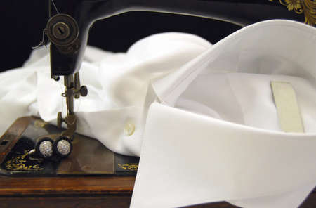 Old sewing machine on a white shirt collarの写真素材