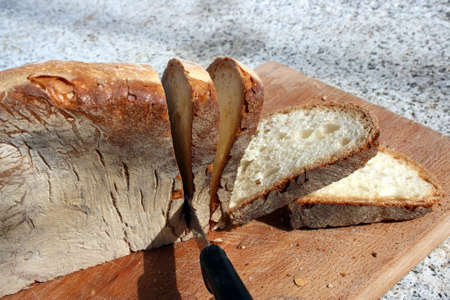 Bread slices with knifeの写真素材