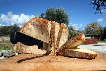 Bread slices with knifeの写真素材