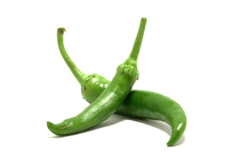 Group of green hot chilli peppers isolated on white backgoundの写真素材