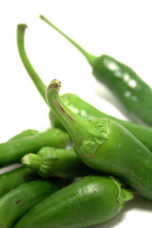 Group of green hot chilli peppers isolated on white backgoundの写真素材