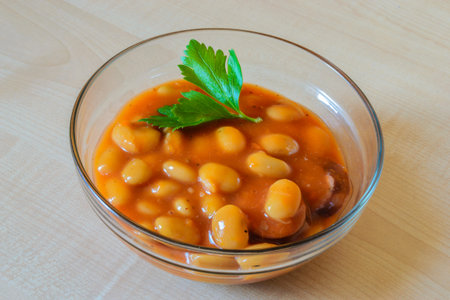 Baked beans in tomato sauce on the table.