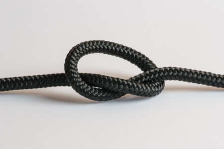 Rope with knot macro on white background.の写真素材