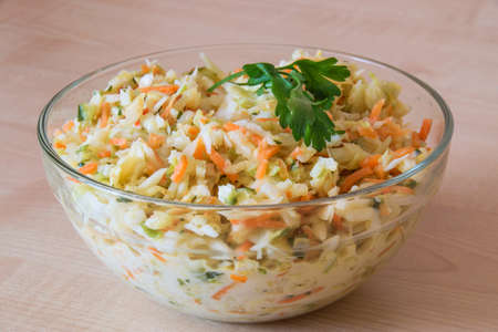 Vegetables salad with cabbage, carrot and cucumber in a bowl. Healthy food.の写真素材