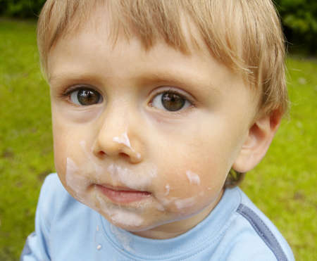  boy with a messy faceの写真素材