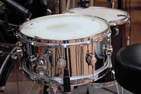 Silver snare drum ready to play with the rest of the kit.の写真素材