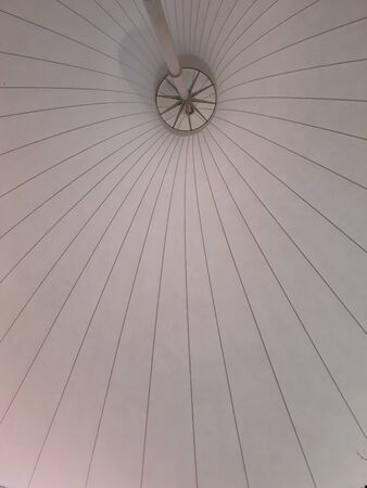 white metal and canvas canopy tensile structure stretched fabric awning sun shadeの写真素材