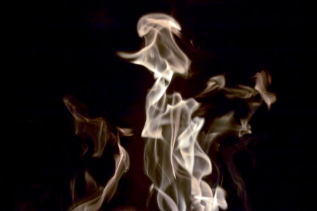 muted flames from log fire