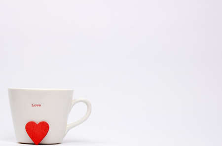 White Mug with word love on it and a heart shapeの写真素材