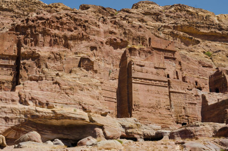 Walking between onstruction of the abandoned city of Petra in Jordanの写真素材