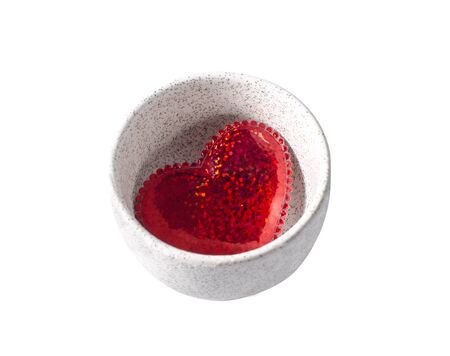 red heart in cup on a white backgroundの写真素材
