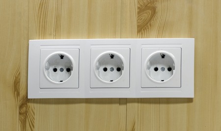 three dirty electrical outlets in the officeの写真素材
