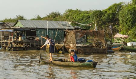 Schoolgirl floating village go home from classesのeditorial素材
