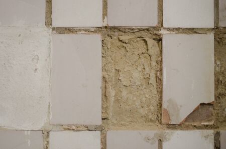 old wall light with an old broken ceramic tilesの写真素材