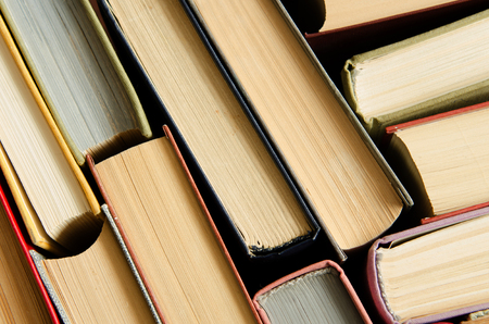 a stack of colorful books in a library or a roomの写真素材