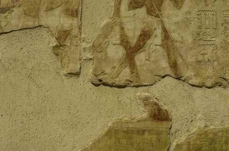 Texture of stones in Egyptian temples. Hieroglyphics writings on ancient walls in a pharaohs old...