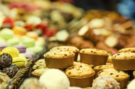 counter with different sweets in the marketの写真素材