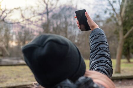 teenager girl taking selfie in the parkの写真素材