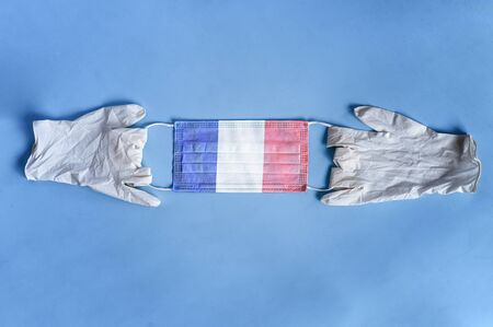 Coronavirus, Covidâ19 in France. mask from coronavirus with French flag and medical glovesの写真素材