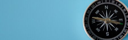 Banner of compass on blue background with copy space using as directionの写真素材