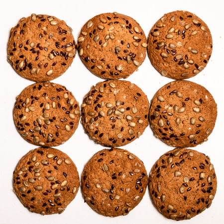 Fresh oatmeal cookies, gingerbread on a light background. Oatmeal gingerbreads sprinkled with...