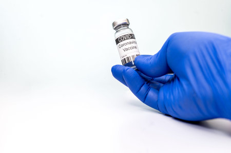 Vaccination. Coronavirus vaccine COVID-19. Coronavirus Vaccine in hand of doctor. Concept of fight...