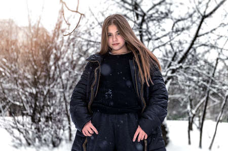 Beautiful sad winter girl portrait. Girl outdoors in winterの写真素材
