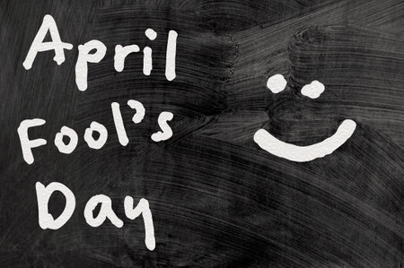April Fool's Day. The inscription on the school board. Dark backgroundの写真素材