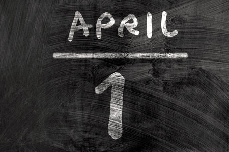 April, 1st fools day reminder on blackboard. Be aware. Directly above shotの写真素材
