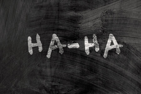 April fools day reminder on blackboard. Be aware. Ha-HA. Directly above shotの写真素材