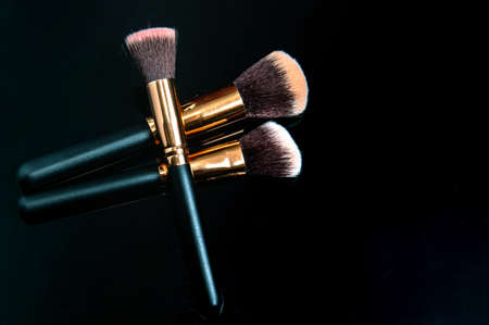 Makeup brushes on black background. Close up of makeup brushes setの写真素材