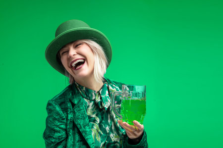 Beautiful woman dressed as a leprechaun with green Irish beer. St. Patrick's woman. St. Patrick...