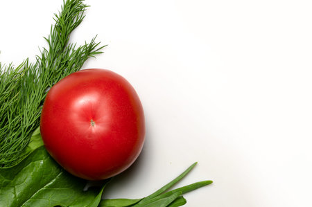 Red tomato and green vegetables and herbs. Delivery or purchase of health food products. green food....