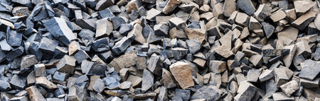 Large gray granite gravel background. Rubble as a background. building stone. banner design