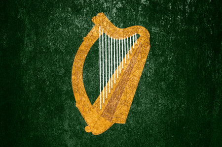 Banner of the grunge old Ireland flag. Dirty old Ireland flag on a metal surface.の写真素材