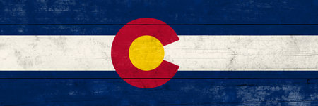 Colorado State flag on a wooden surface. Banner of the grunge Colorado State flag.の写真素材