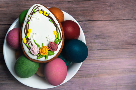 Easter gingerbread cookies on wooden table. Egg shaped cookies for Easter
