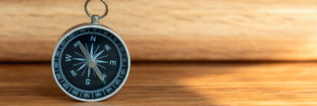 Banner of compass on wooden background with copy space using as directionの写真素材