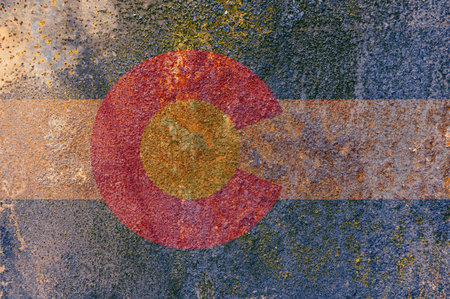 Colorado State Flag. Dirty Colorado state flag on rusty metal surface. Rusty metal textureの写真素材