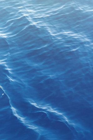 Sea surface. Blue water texture. Close up blue water surface at deep ocean. Vertical image