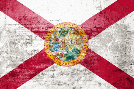 Dirty Florida state flag on the wall. Grunge wall textureの写真素材