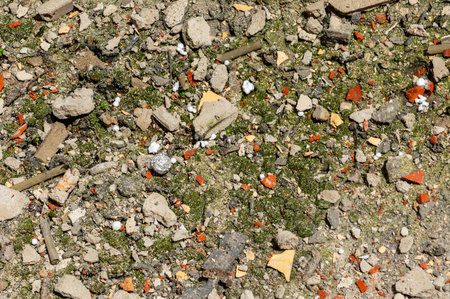 Construction waste close up. Broken bricks, demolition debris, and destruction fragments and rubbish