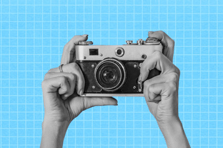 Woman taking retro photos. Digital collage with female hands holding vintage camera. Pop art design. Concept of social mediaの写真素材