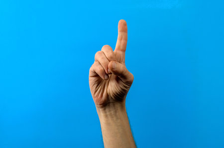 Hand with index finger pointing up. Idea concept.の写真素材