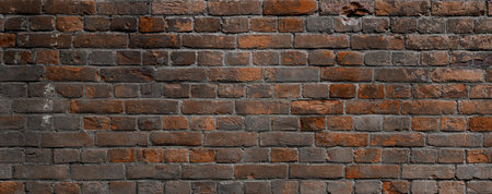 Brick background. Surface of old red brick wall. Old brick wall is weathered and destroyed.