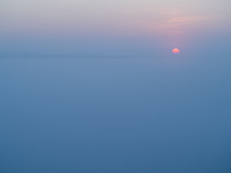 Misty sunrise on the Bug river in summer