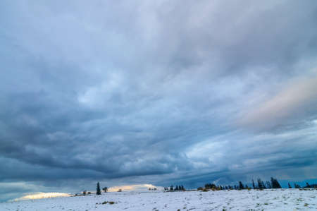 Sunset visible in Podhale (Poland). Cloudy sky with glimpses of the sun.の写真素材
