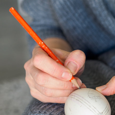 Decorating an Easter egg. needlework. Traditional Easter customs in Poland.の写真素材
