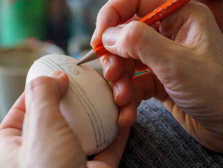 Decorating an Easter egg. needlework. Traditional Easter customs in Poland.の写真素材